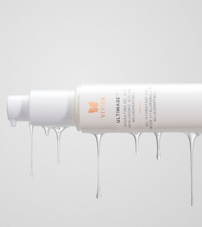 Tube of Vivier Ultimage skincare cream with product drips against a soft grey background
