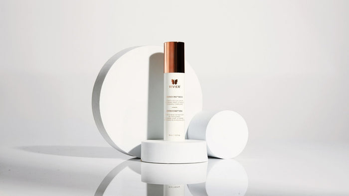 Vivier GrenzCine Neck cream displayed on minimalist white pedestals against a clean white background.