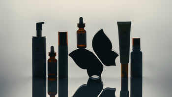 Vivier skincare products arranged with butterfly logo on reflective surface